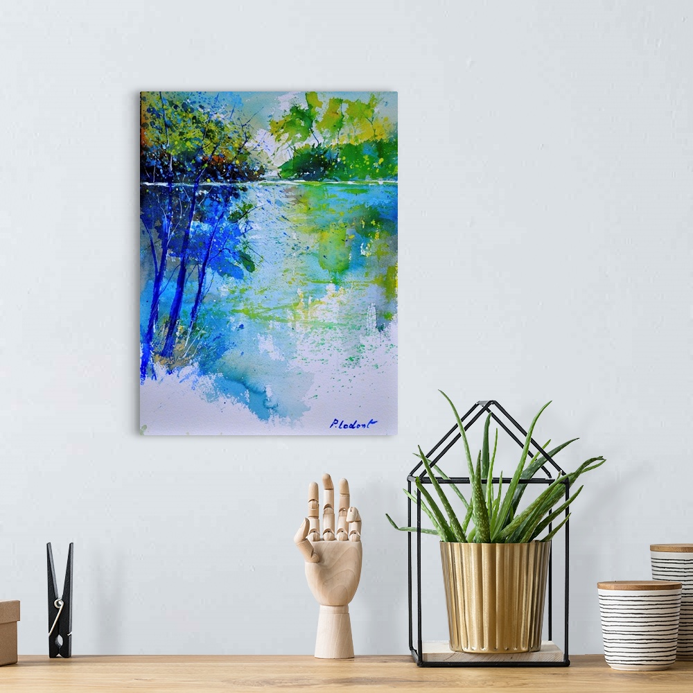 A bohemian room featuring A vertical watercolor landscape of trees next to water in bright colors of green and blue.