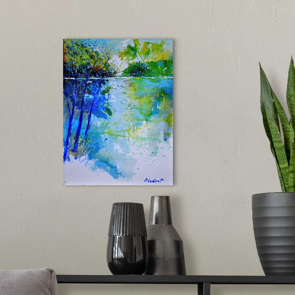 A modern room featuring A vertical watercolor landscape of trees next to water in bright colors of green and blue.