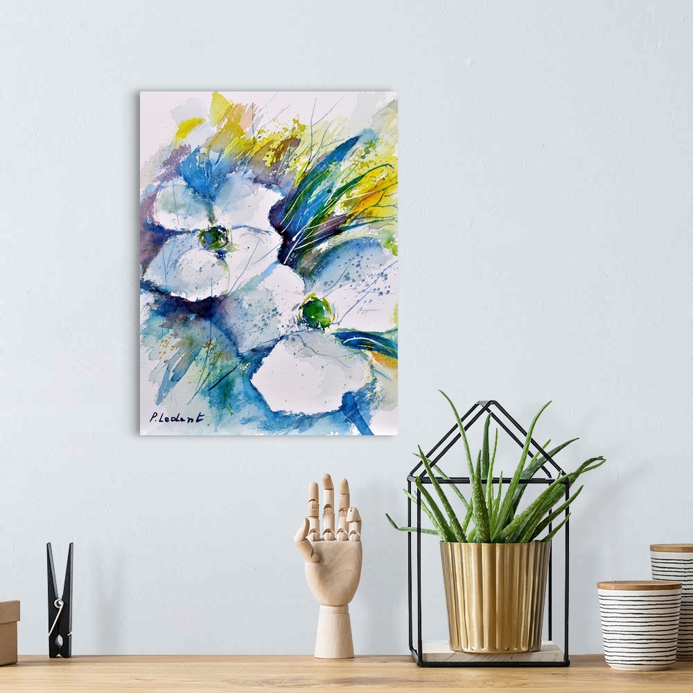 A bohemian room featuring Vertical watercolor painting of white flowers and leaves done in shades of blue, green and yellow.