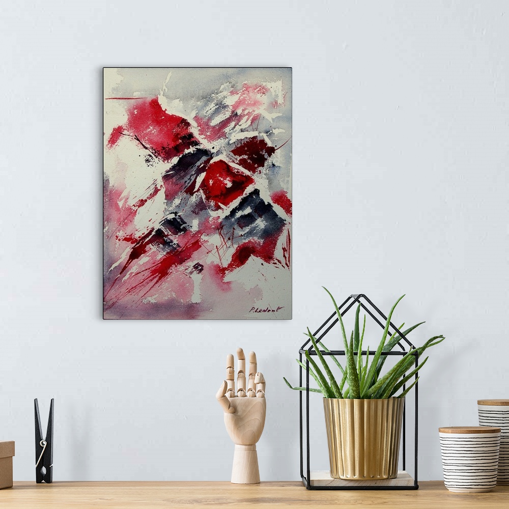 A bohemian room featuring A vertical abstract painting of colors of red, white and black in bold brush strokes and splatter...