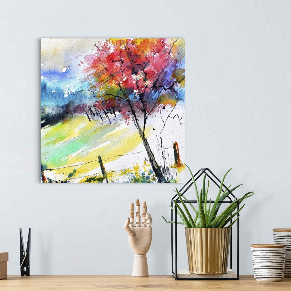 A bohemian room featuring A square watercolor landscape of a tree in autumn colors.