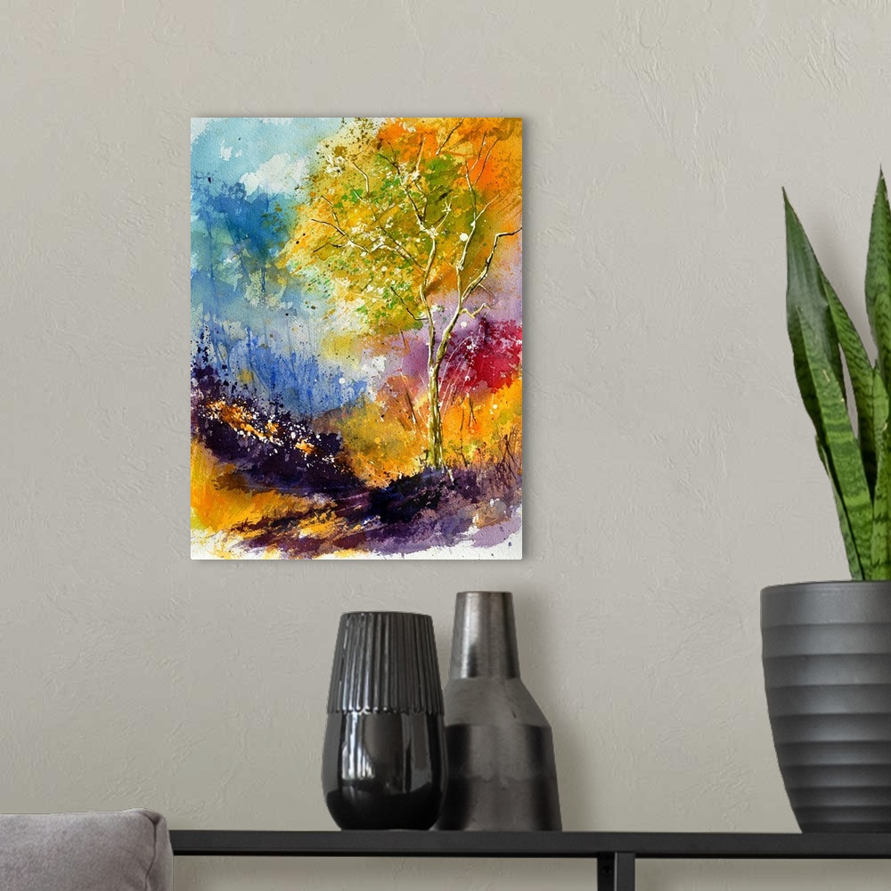 A modern room featuring Vertical watercolor painting of vibrant colors in shades of blue, orange and purple.