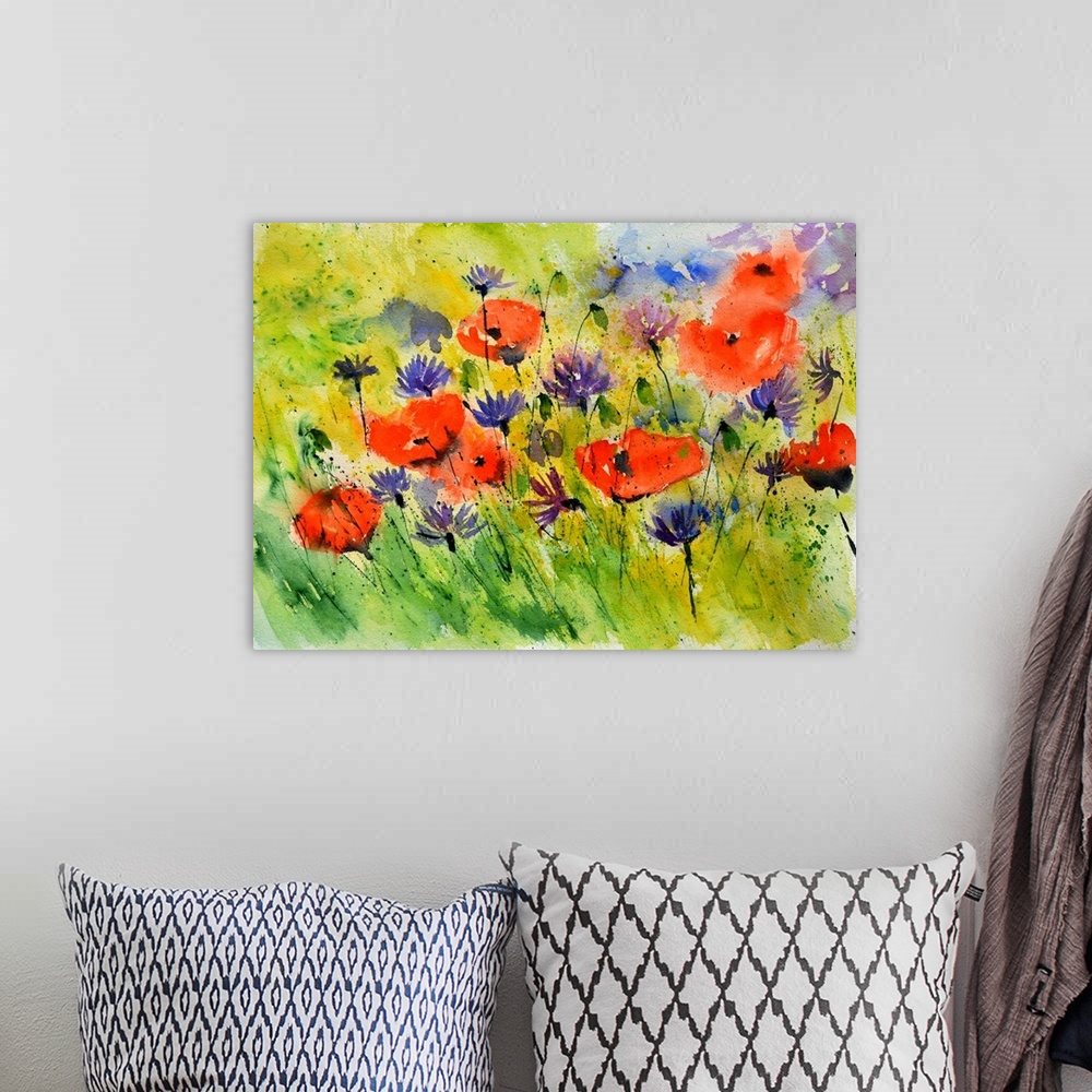 A bohemian room featuring Horizontal watercolor painting of bright red poppies and purple flowers in a field.