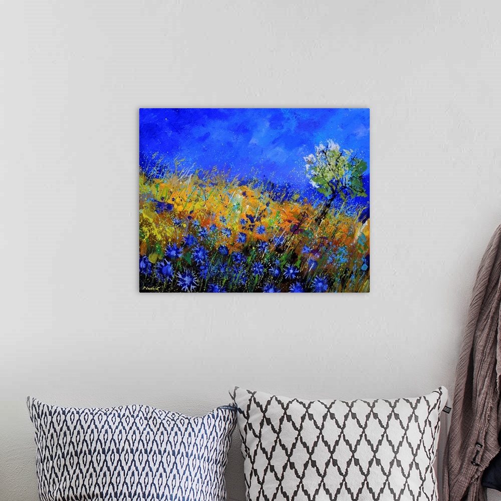 A bohemian room featuring Contemporary abstract painting of a field of blue flowers.