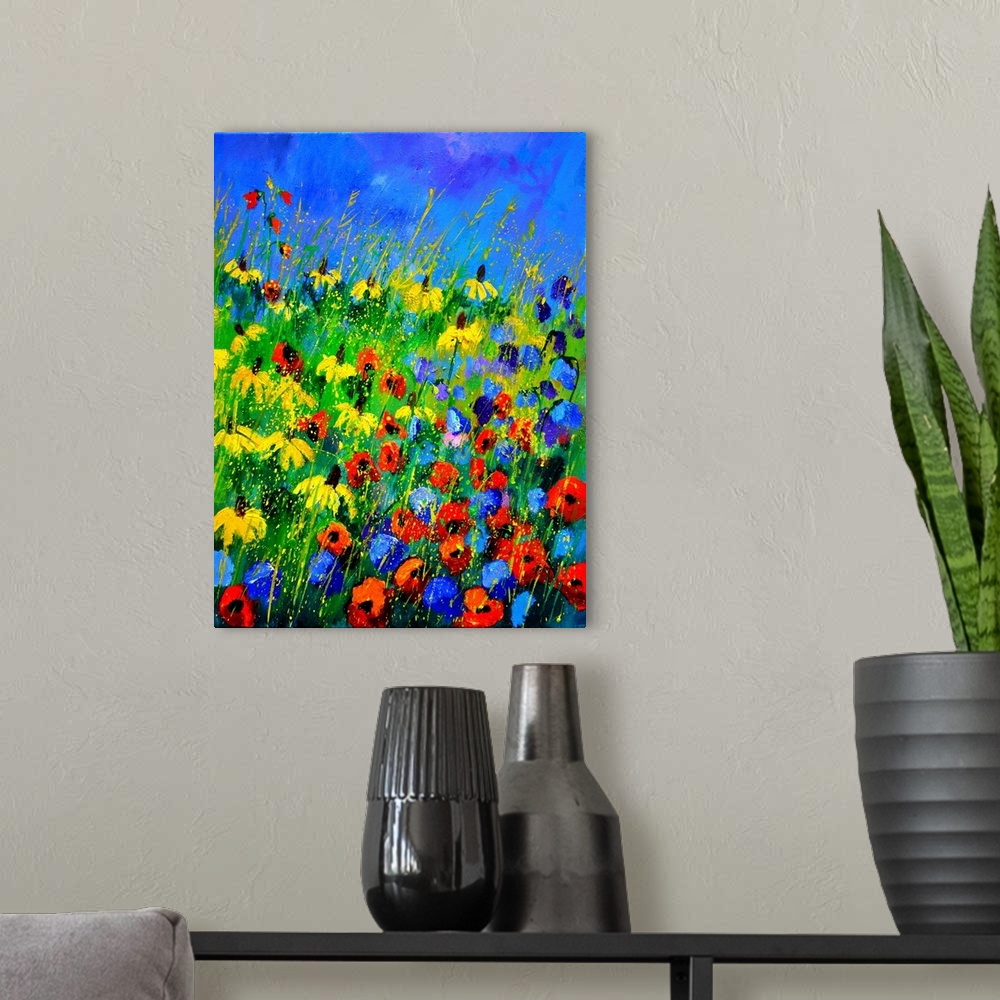 A modern room featuring Vertical painting of a a field of colorful wild flowers and a bright blue sky with small speckles...