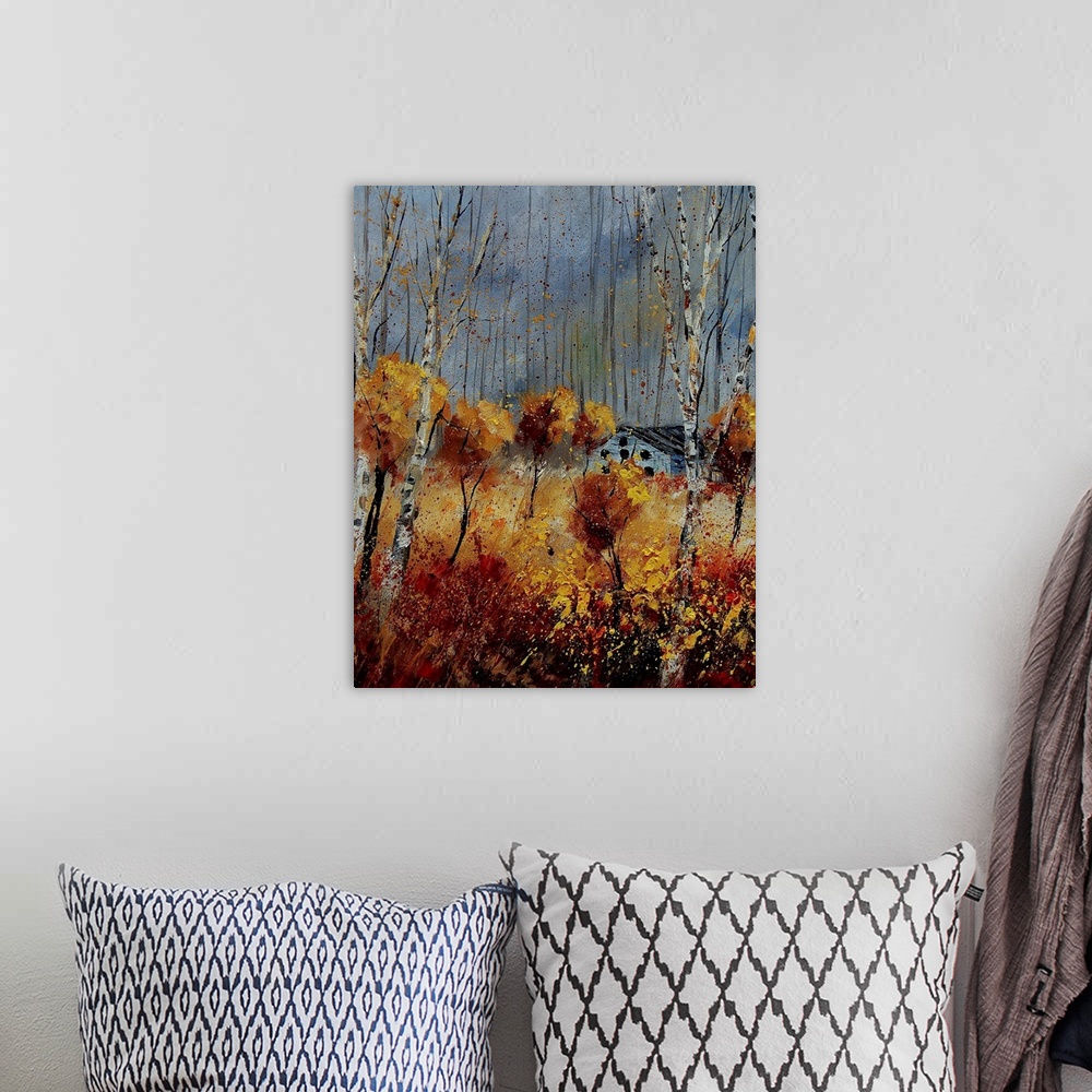 A bohemian room featuring Vertical painting of lively orange leaved  trees surrounding a small house on an autumn day.