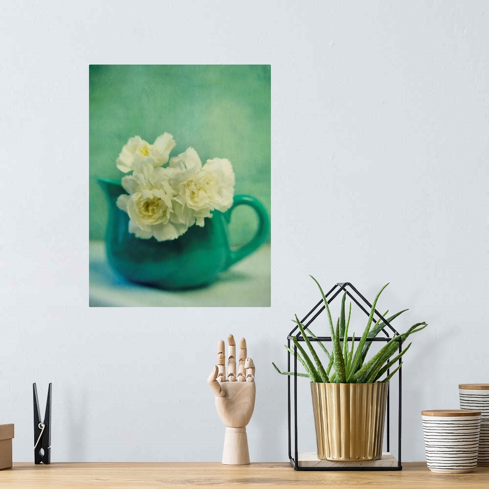 A bohemian room featuring Still life with carnations in a jar, taken with a blur.