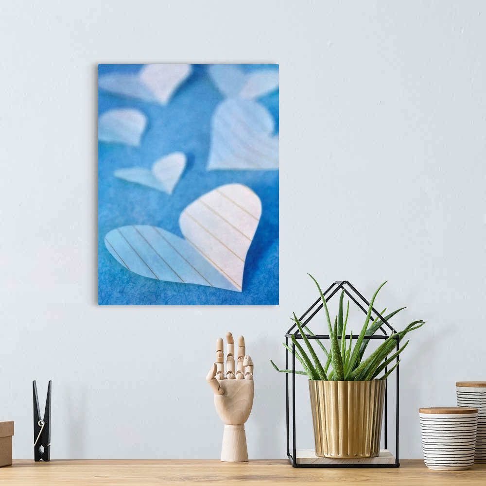 A bohemian room featuring Paper hearts, a sweet still life in blue tones