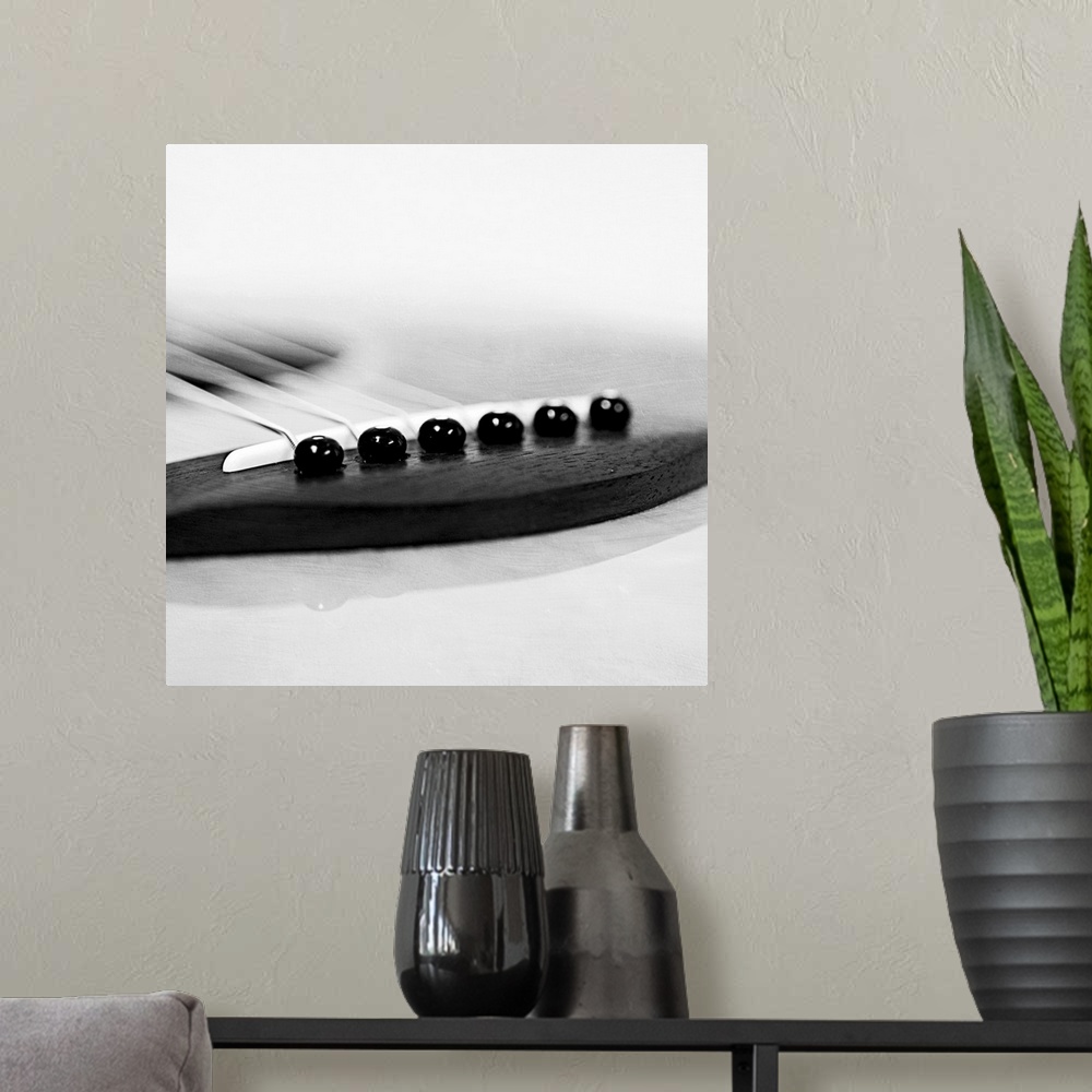 A modern room featuring Detail of a guitar in toned black