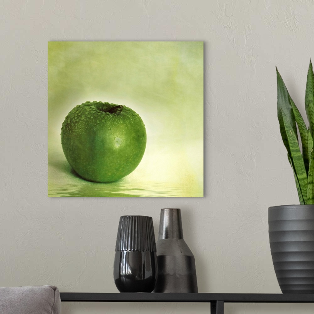 A modern room featuring Green apple with water drops and reflection in the water
