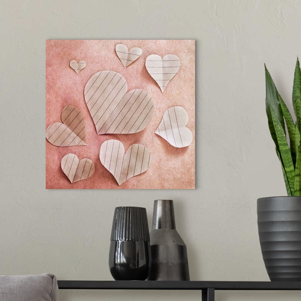 A modern room featuring Hearts, cut out of paper, arranged as a still life