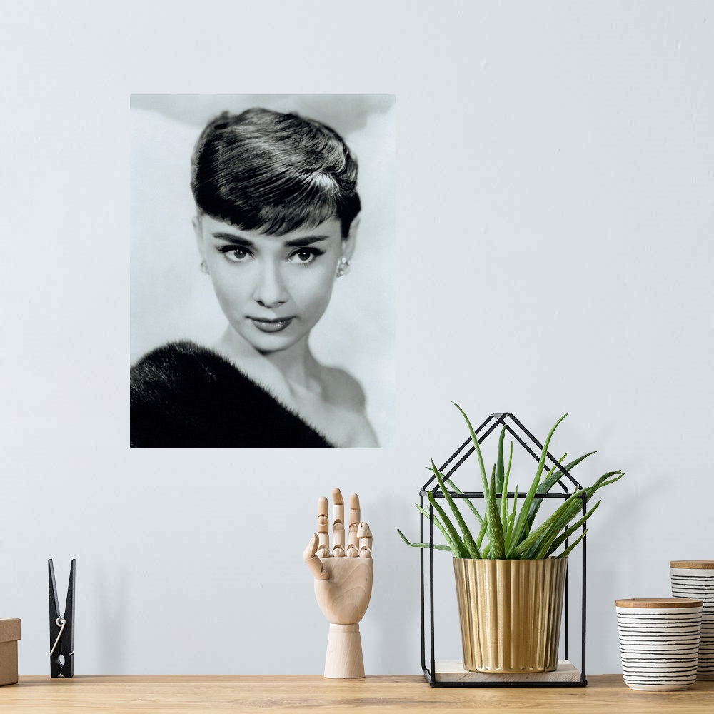 A bohemian room featuring Black and white photo of a movie starlet printed on canvas.