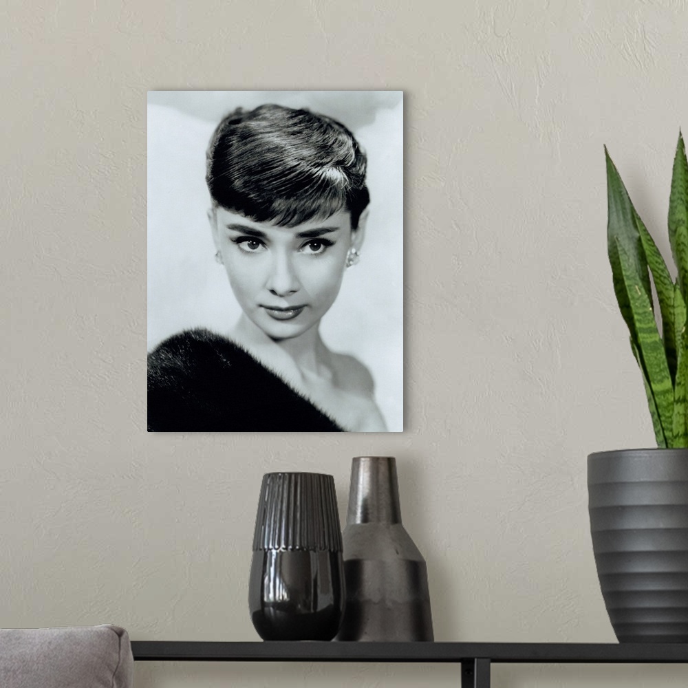A modern room featuring Black and white photo of a movie starlet printed on canvas.