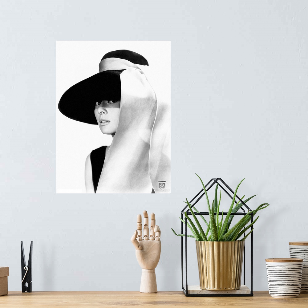 A bohemian room featuring Black and white photo of Audrey Hepburn in a black dress and large floppy black hat with a white ...