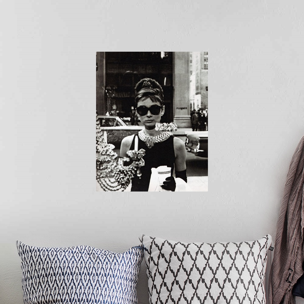 A bohemian room featuring Movie still of the actress Audrey Hepburn wearing an elegant black dress and extravagant jewelry ...