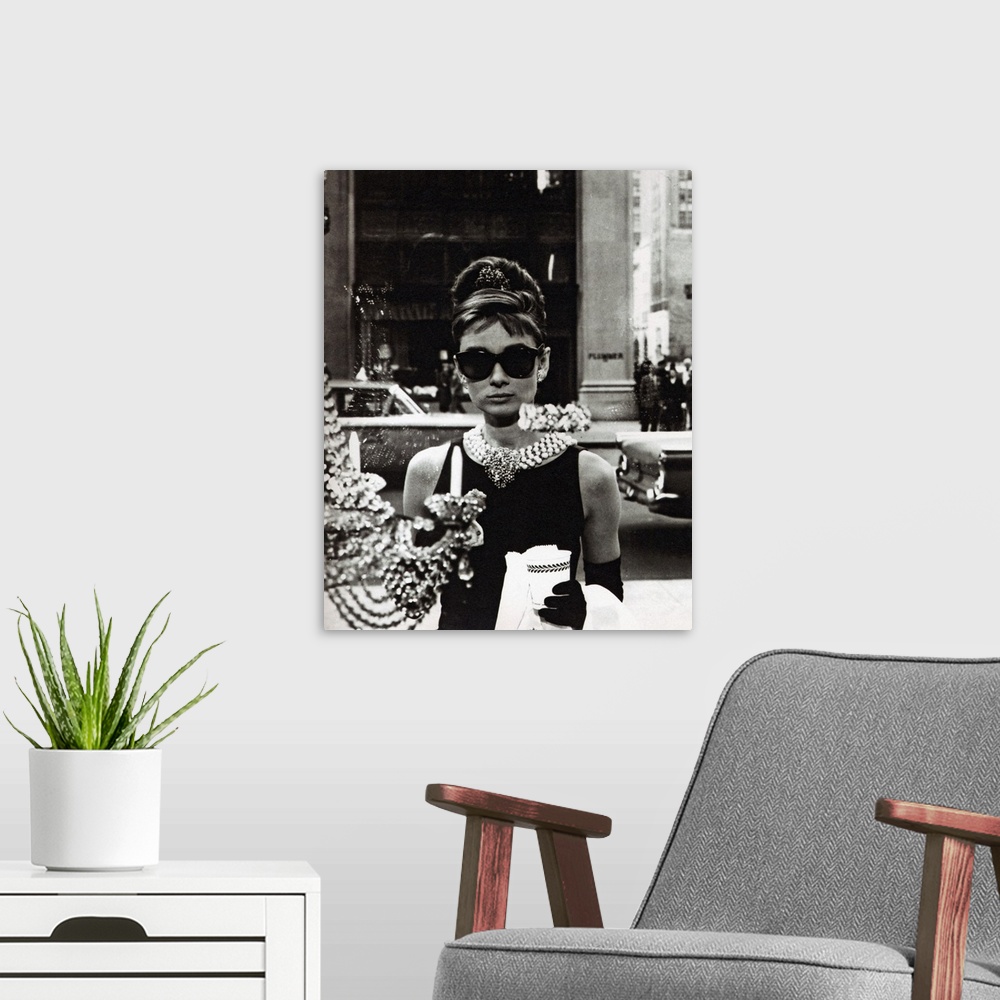 A modern room featuring Movie still of the actress Audrey Hepburn wearing an elegant black dress and extravagant jewelry ...