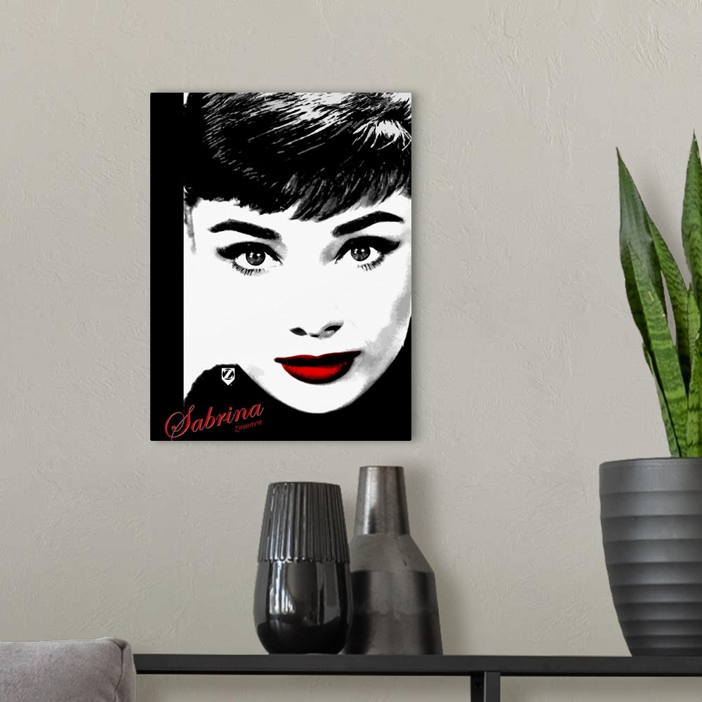 A modern room featuring Portrait, large wall hanging of the face of Audrey Hepburn, the only part of the image in color i...