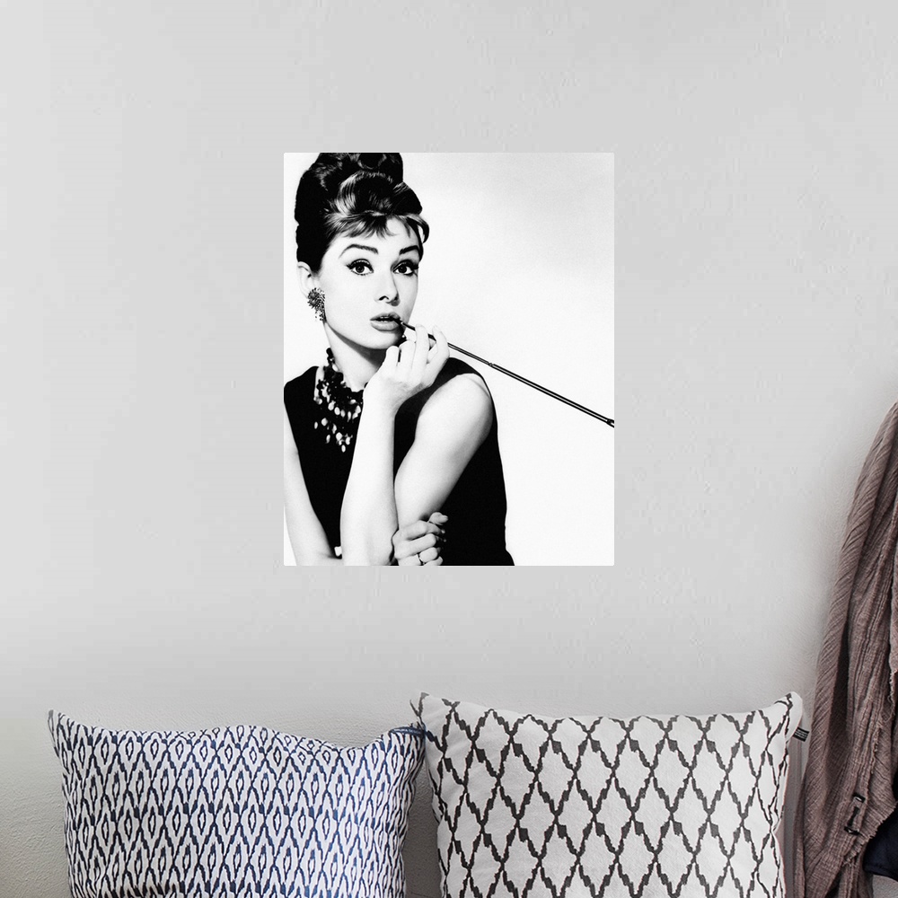 A bohemian room featuring Black and white photograph of Audrey Hepburn from Breakfast at Tiffany's.