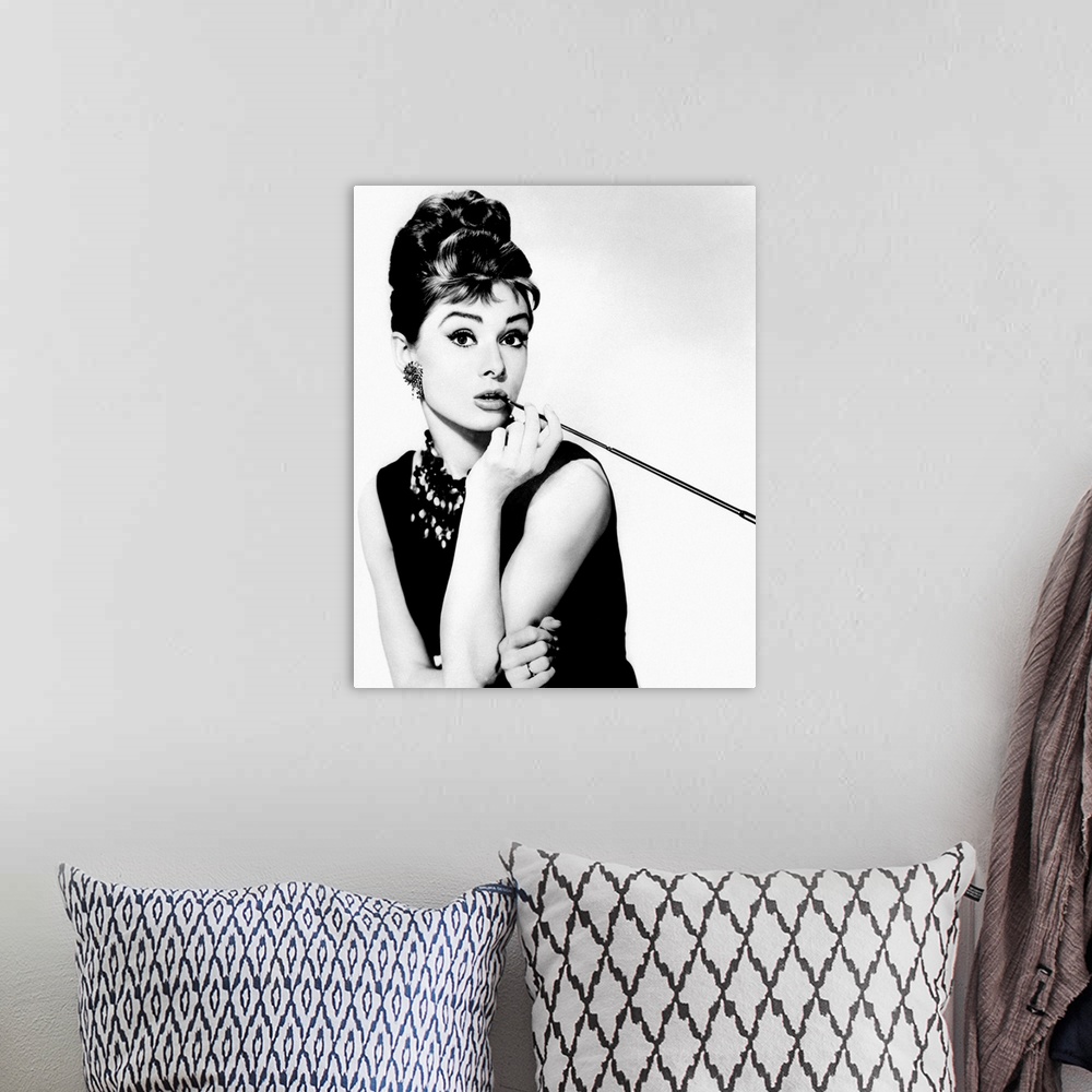 A bohemian room featuring This wall art is a portrait photograph of the Hollywood Icon character Holly Golightly in her sig...