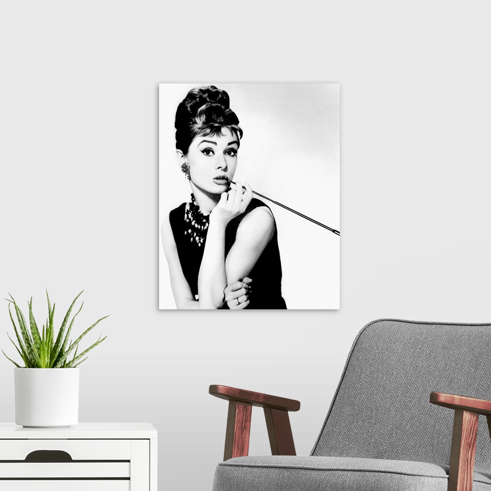 A modern room featuring This wall art is a portrait photograph of the Hollywood Icon character Holly Golightly in her sig...