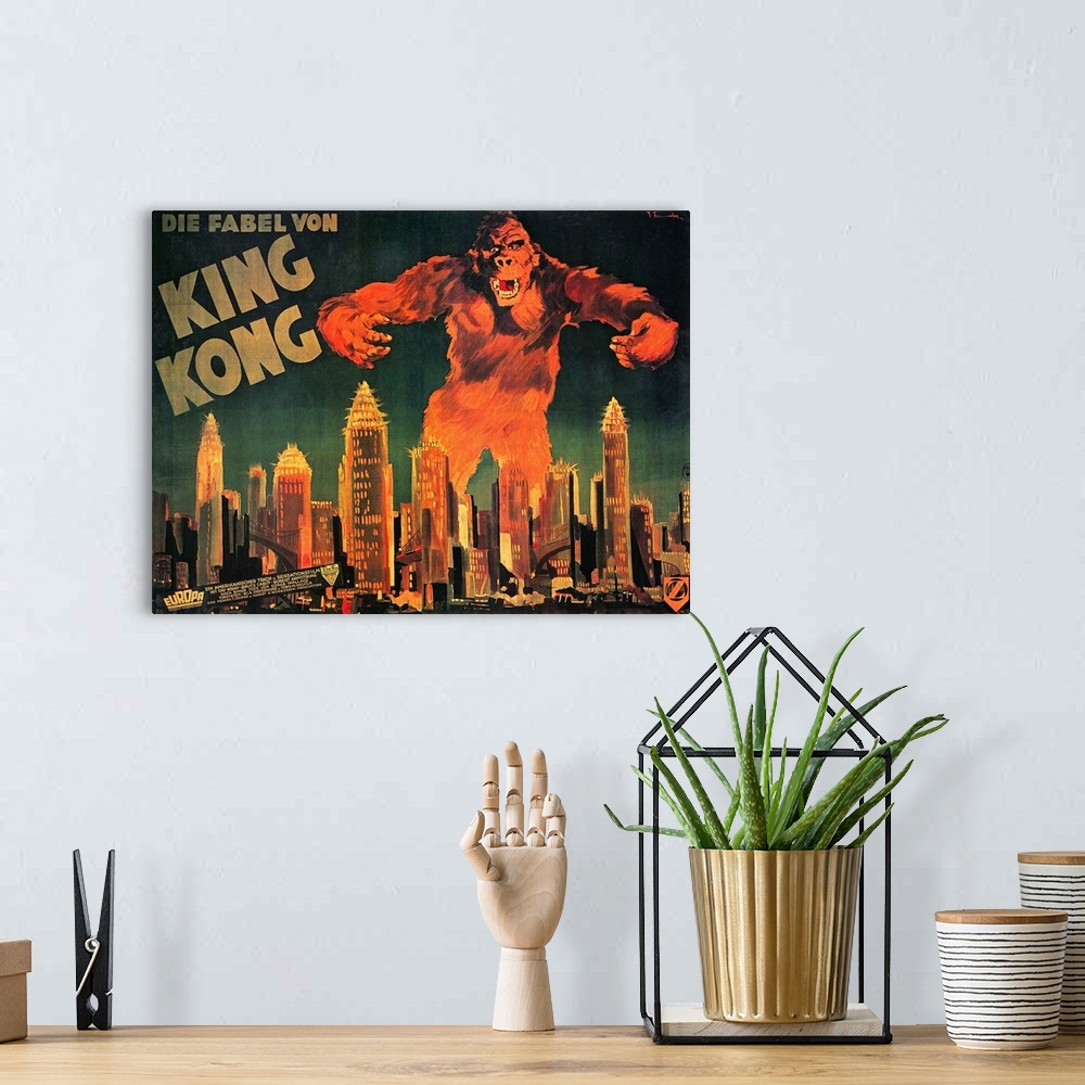 A bohemian room featuring Large landscape vintage artwork of King Kong, as the large ape towers over the skyscrapers in a c...
