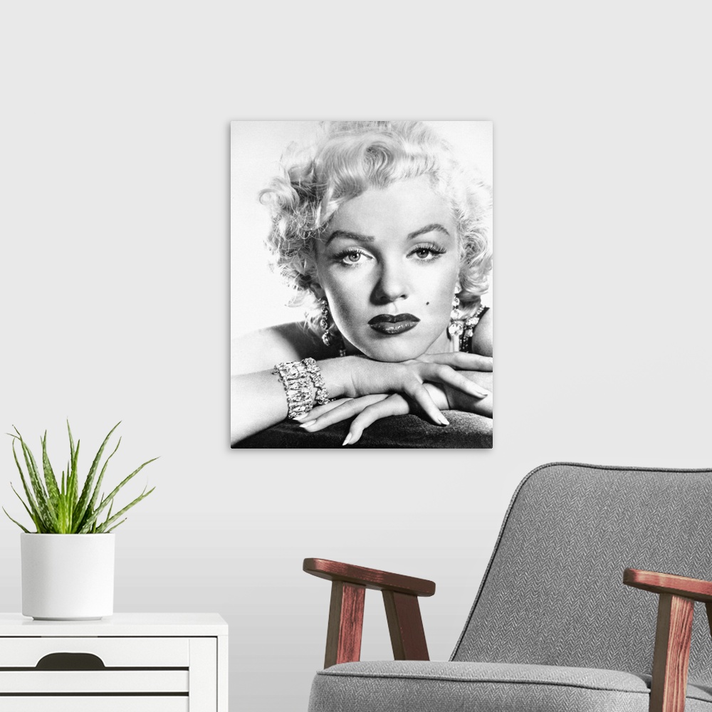 A modern room featuring This is a monochromatic portrait photograph from the shoulders up of the Hollywood Icon wearing m...