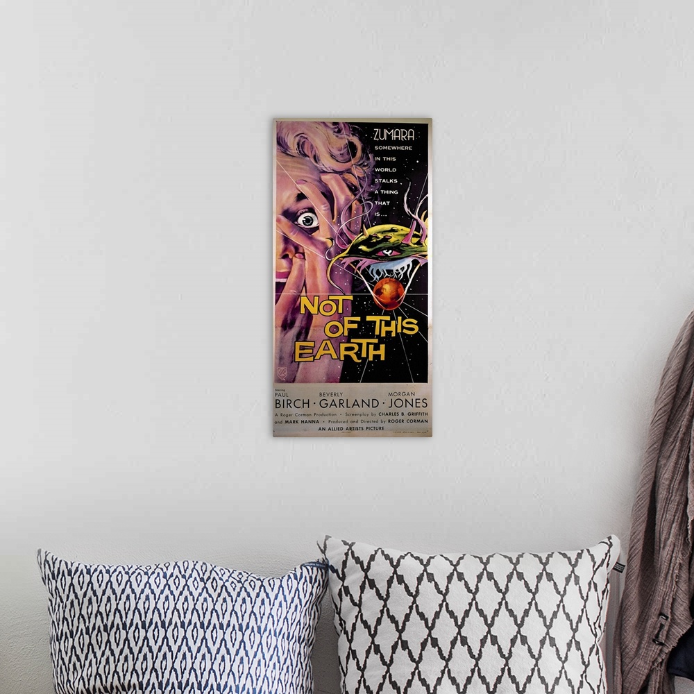 A bohemian room featuring Not of This Earth Sci Fi Movie Poster