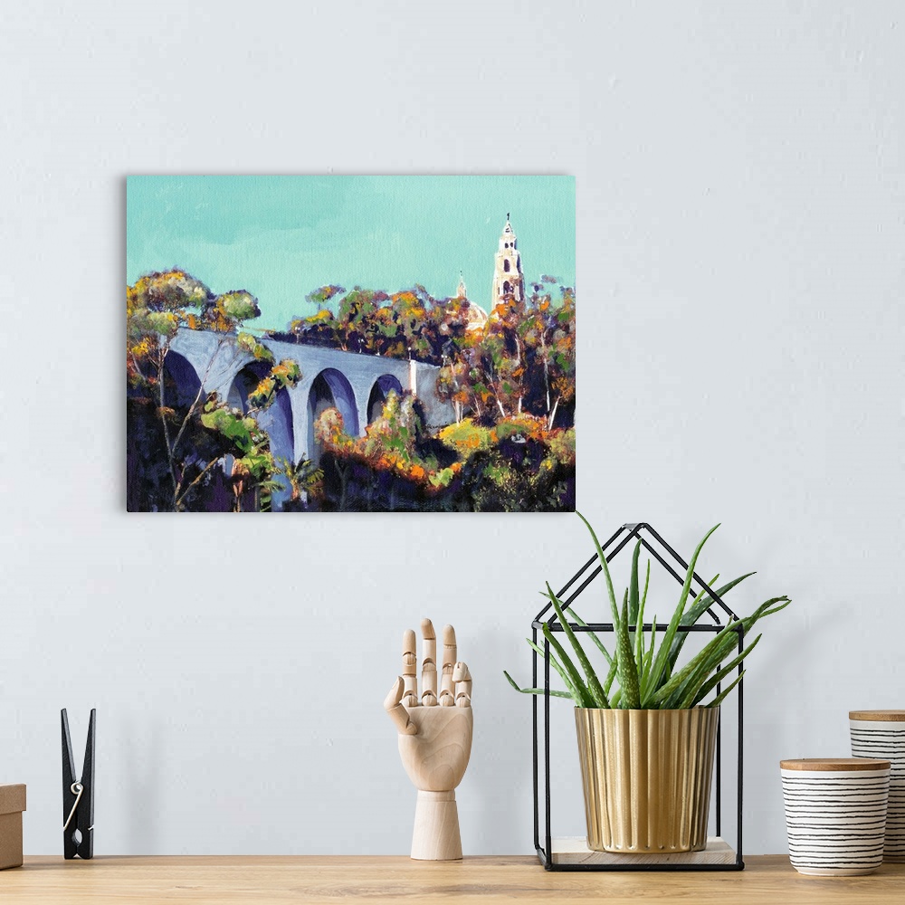 A bohemian room featuring Cabrillo Bridge Balboa Park San Diego painting by RD Riccoboni. The California Building is seen a...