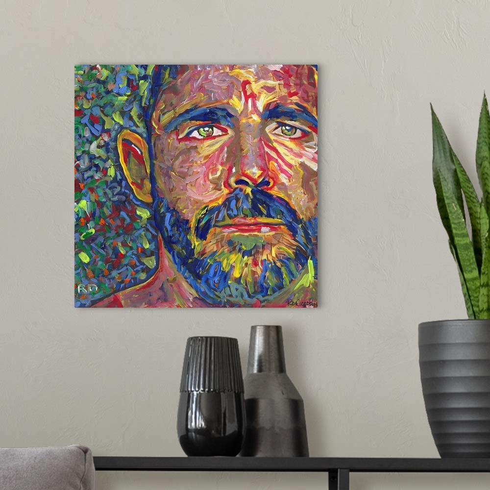 A modern room featuring I Am Bear by RD Riccoboni. A man with a beard and green eyes.