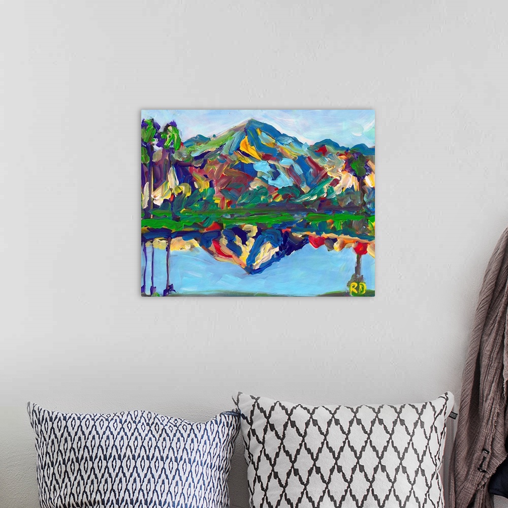 A bohemian room featuring Palm Springs San Jacinto Reflection, abstract desert landscape painting by RD Riccoboni. Blues, g...