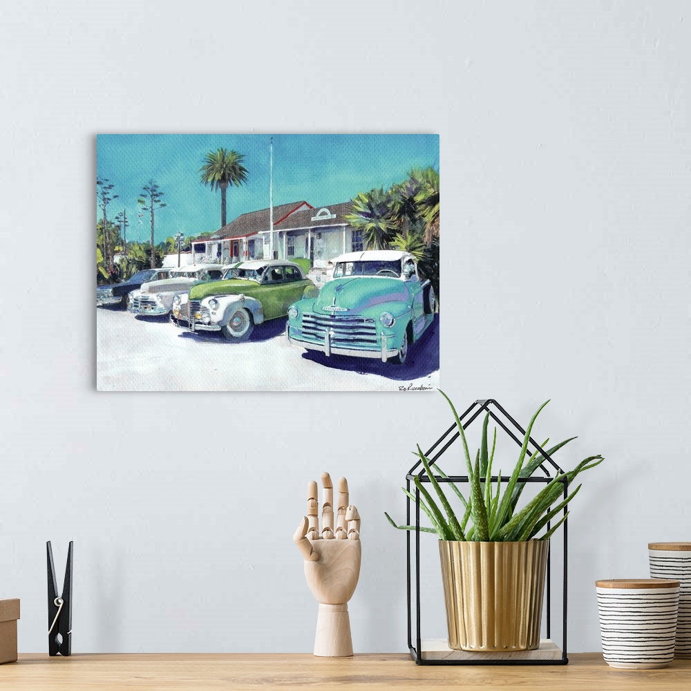 A bohemian room featuring Contemporary painting of vintage cars parked outside in Old Town San Diego, California.