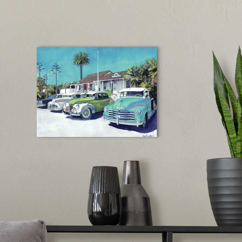A modern room featuring Contemporary painting of vintage cars parked outside in Old Town San Diego, California.