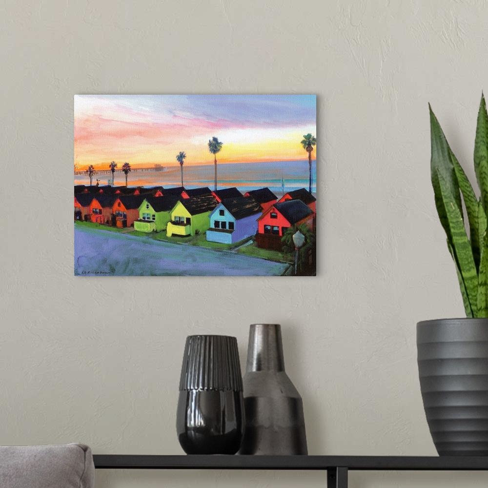 A modern room featuring Painting of the sunrise over Oceanside California with Roberts multicolored Cottages and Oceansid...