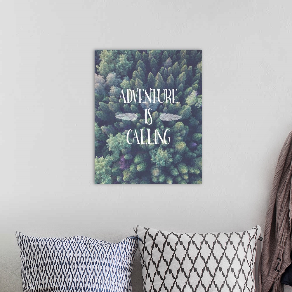 A bohemian room featuring Motivational phrase embellished with feathers over an aerial image of a forest.