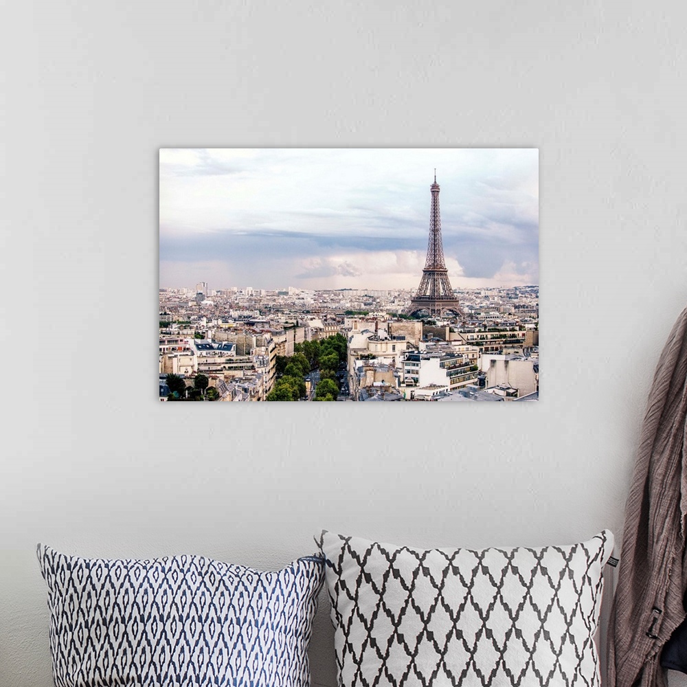 A bohemian room featuring Aerial photograph of a Paris cityscape with the Eiffel Tower towering over all the buildings.