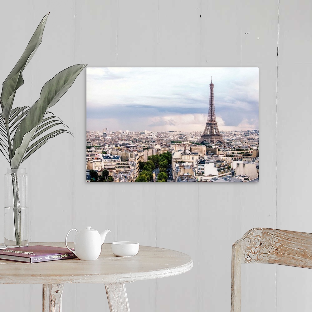 A farmhouse room featuring Aerial photograph of a Paris cityscape with the Eiffel Tower towering over all the buildings.