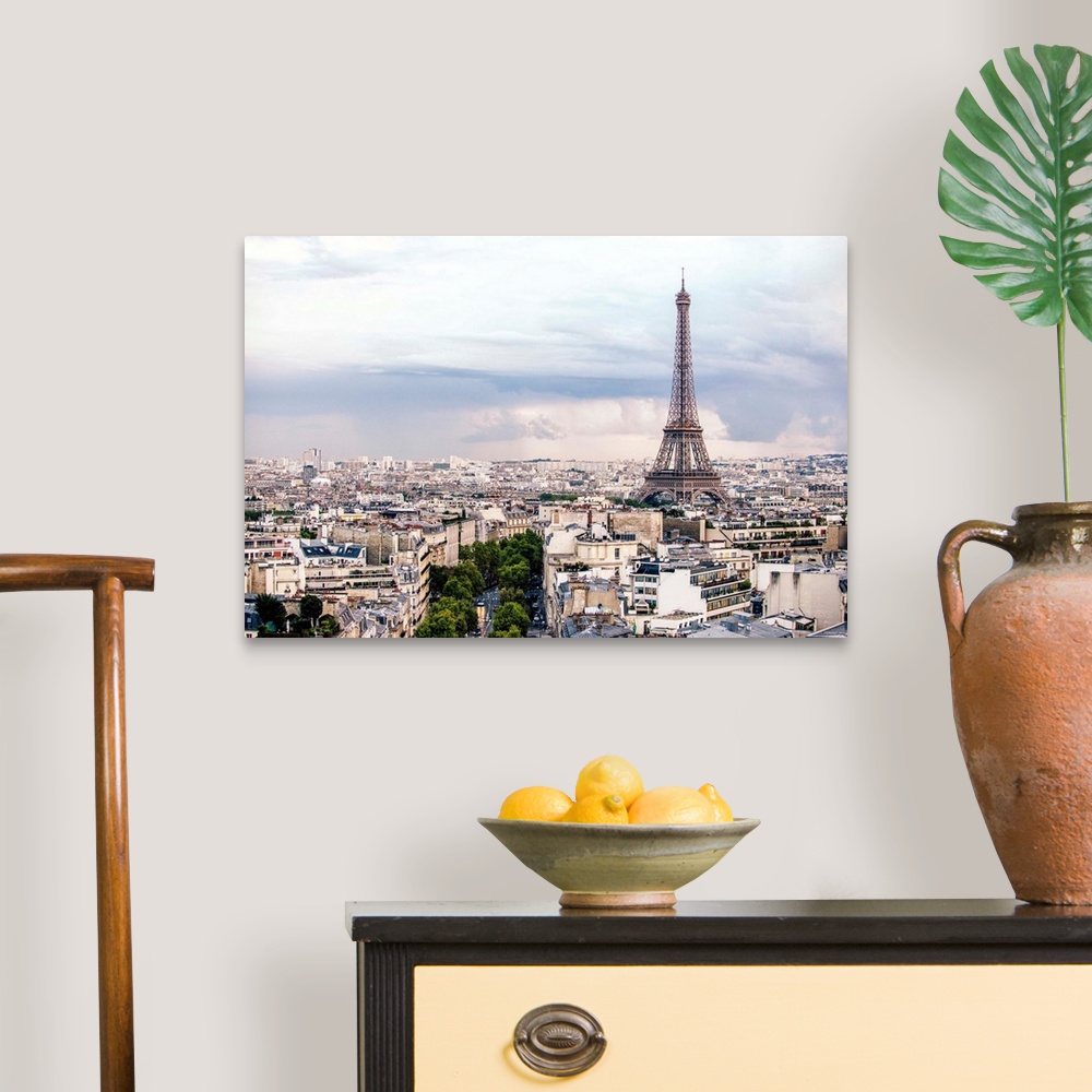 A traditional room featuring Aerial photograph of a Paris cityscape with the Eiffel Tower towering over all the buildings.