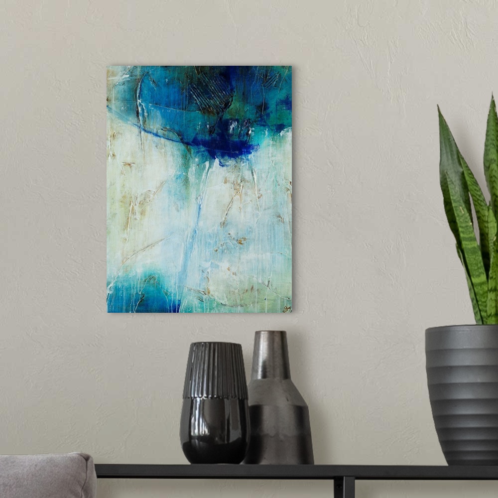 A modern room featuring Abstract art of a large mass of cool colors at the top, with a single line of blue that leads dow...