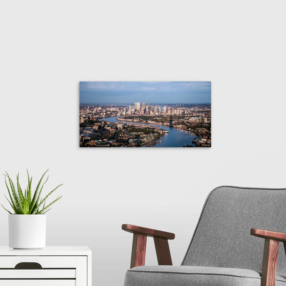 A modern room featuring Aerial view of Canary Wharf and River Thames in London, England.