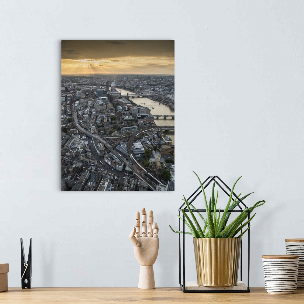 A bohemian room featuring Aerial photograph of the city of London at golden hour with the River Thames flowing on the right.