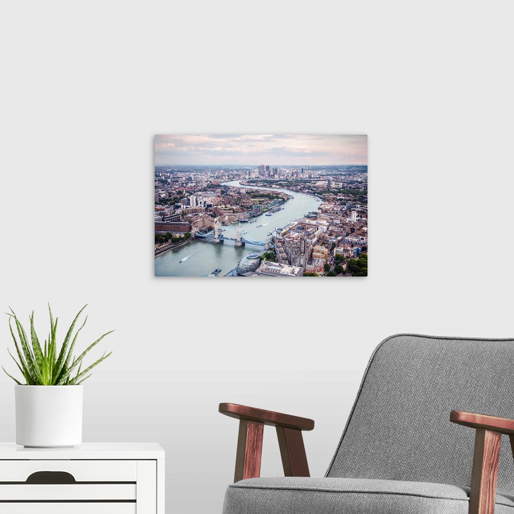 A modern room featuring Aerial view of River Thames and Tower Bridge in London, England.