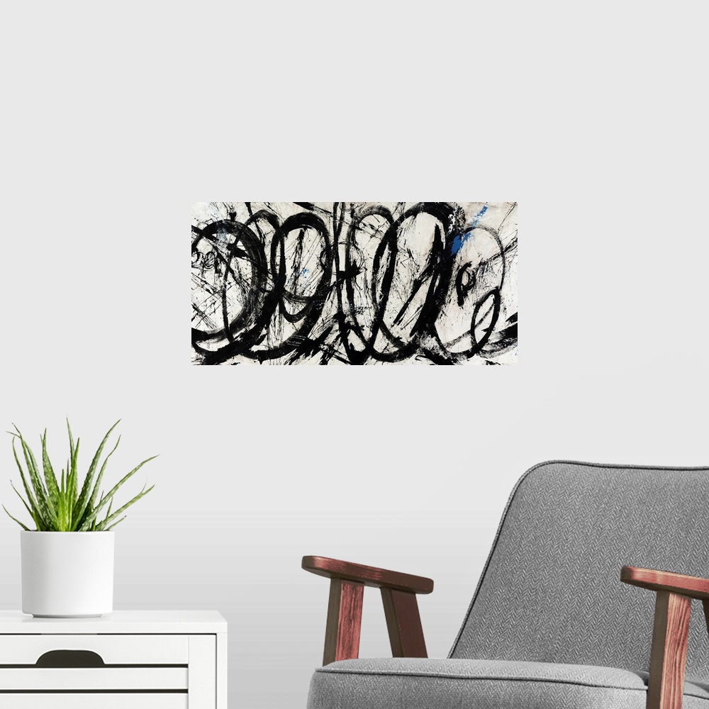 A modern room featuring An abstract piece of artwork that has swirls of black paint throughout the panoramic print.