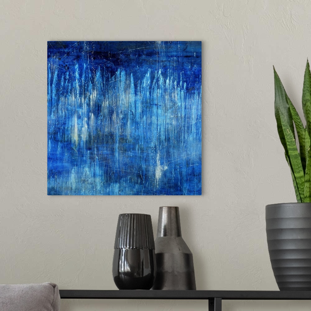A modern room featuring Big, landscape, abstract painting in blue tones of light vertical streaks in transitioning blue t...