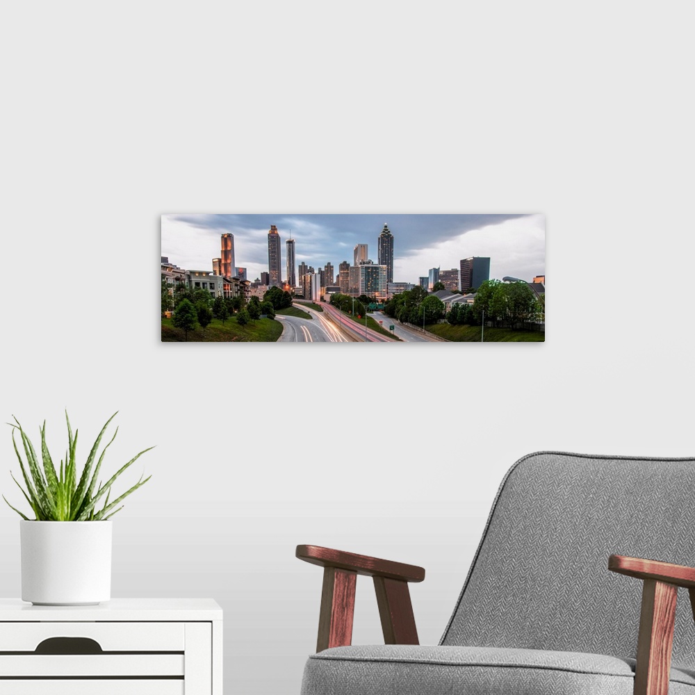 A modern room featuring Panoramic photo of skyscrapers in the Atlanta, Georgia skyline in the late afternoon.