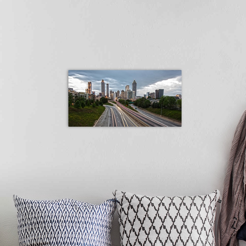 A bohemian room featuring Skyscrapers in the Atlanta, Georgia skyline and light trails from passing cars on the roads in th...