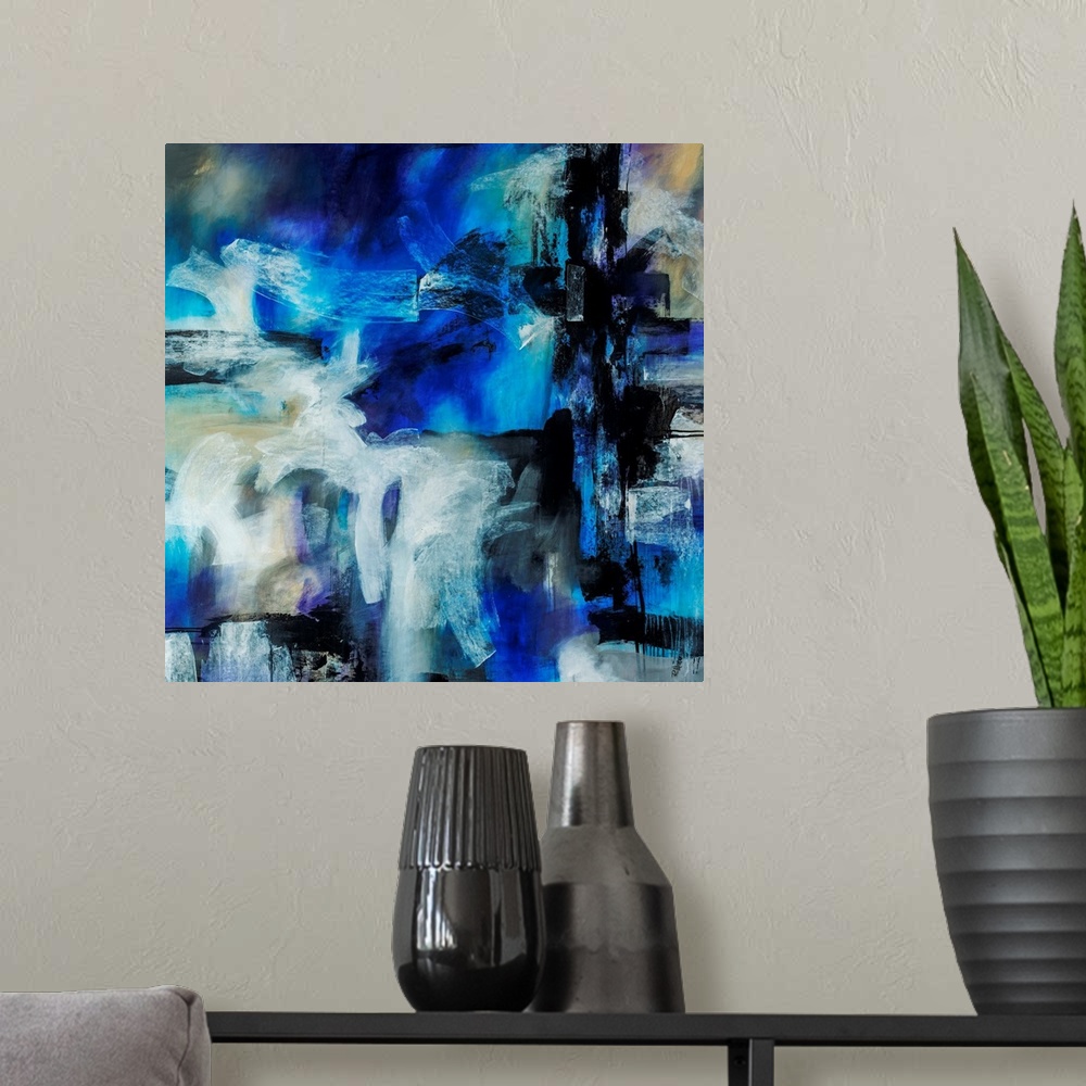 A modern room featuring Abstract artwork painted with bright blue tones underneath thick black and white brushstrokes.