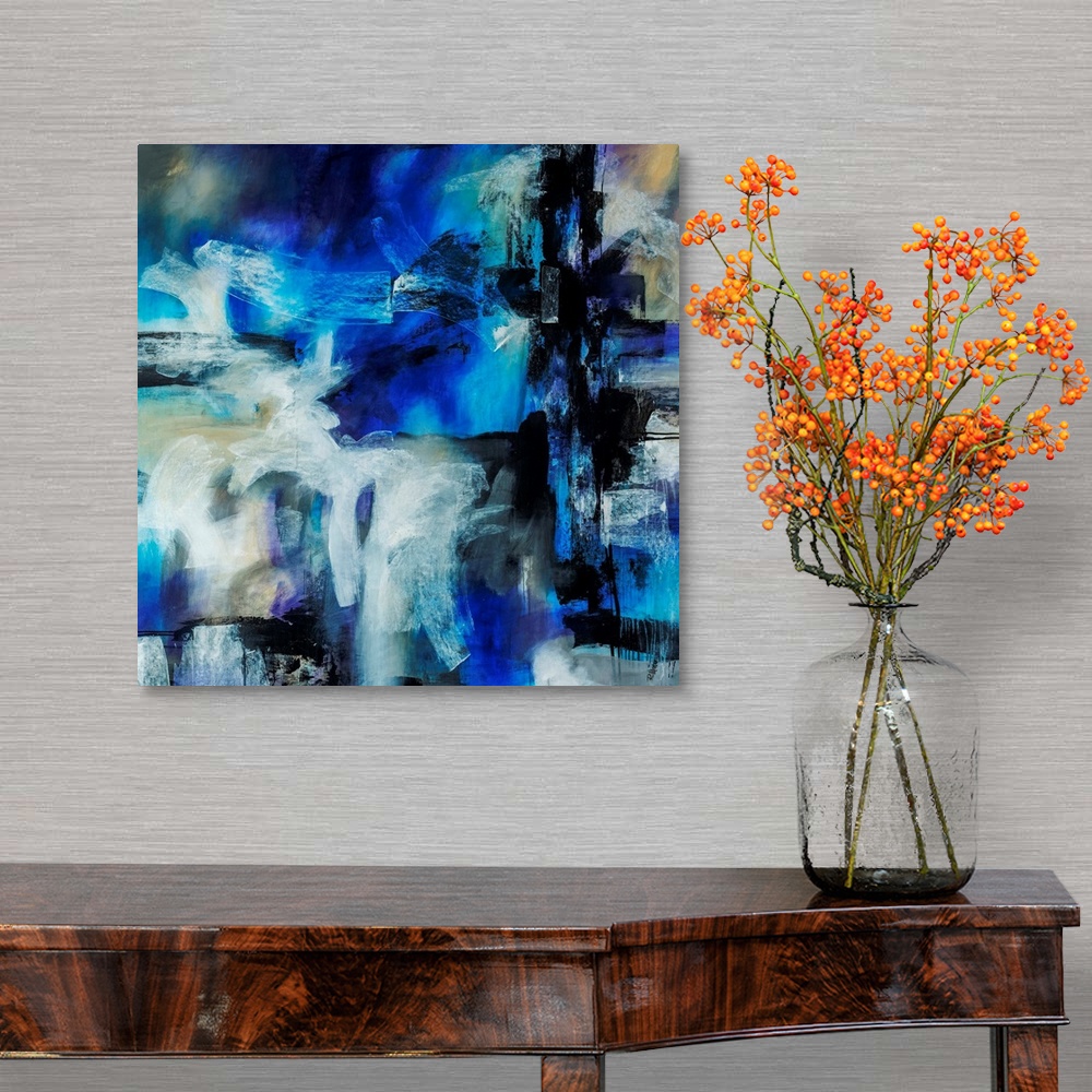 A traditional room featuring Abstract artwork painted with bright blue tones underneath thick black and white brushstrokes.