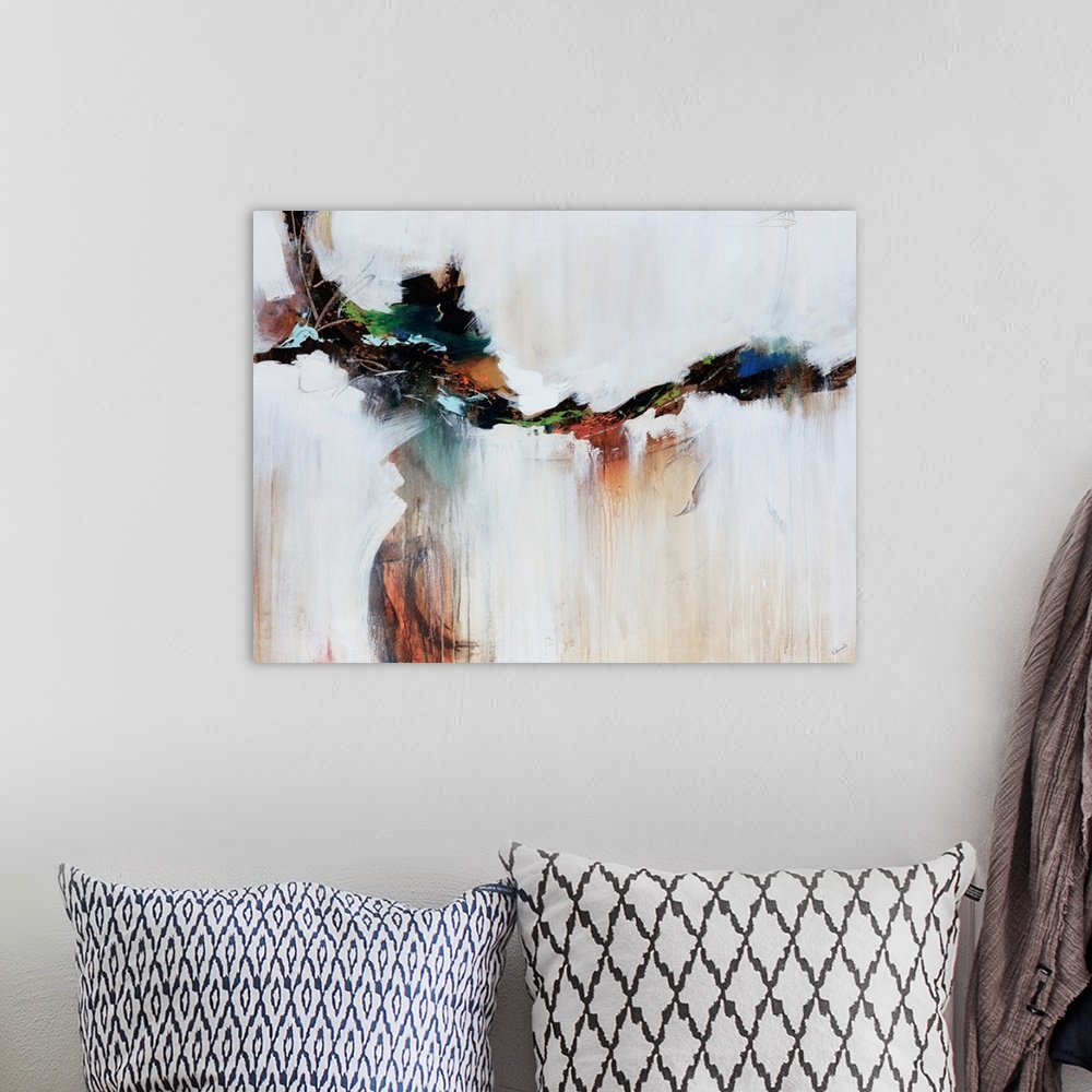 A bohemian room featuring Earthly tones cut through the middle of ivory tones in this abstract painting.