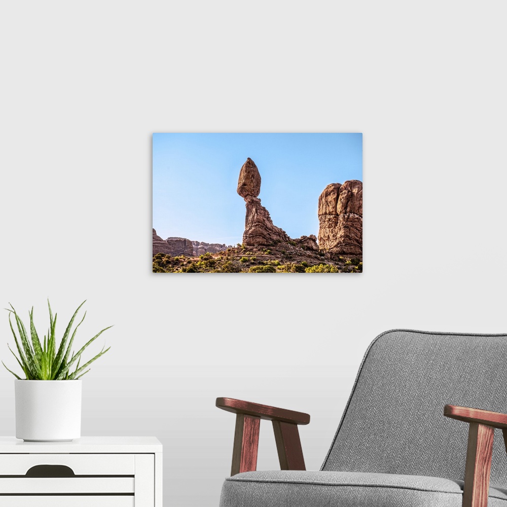 A modern room featuring Morning sunlight shining on the Balanced Rock sandstone formation, Arches National Park, Moab, Utah.