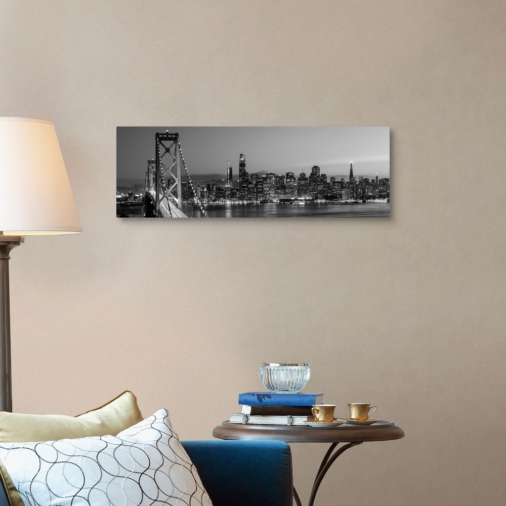 A traditional room featuring Photograph of the Bay Bridge and the San Francisco skyline lit up at dusk.